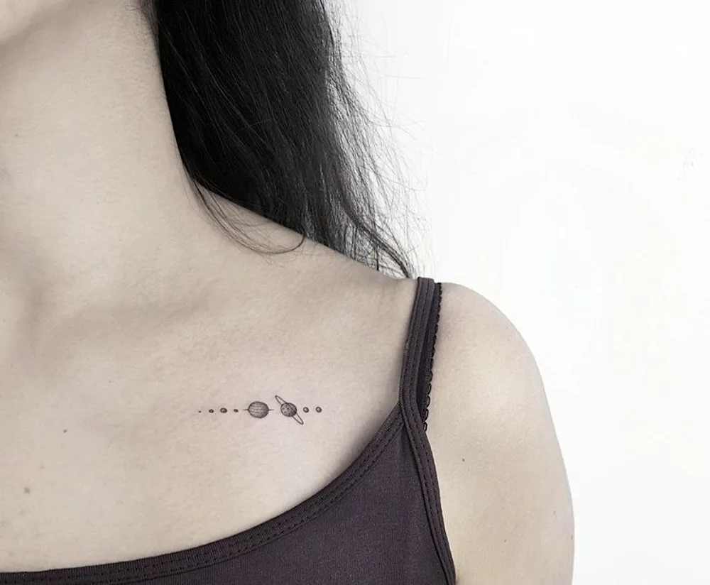 Mini tattoo on collarbone