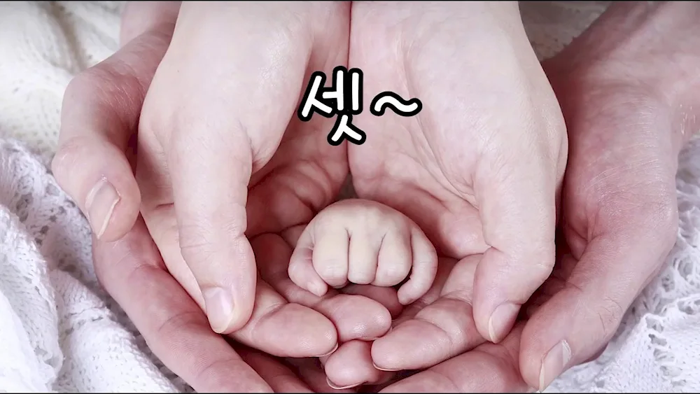 Baby in hands