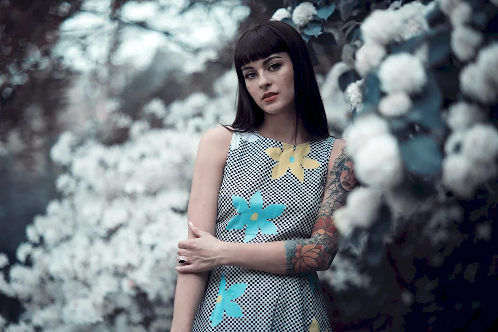 Brunette with fringes in a dress