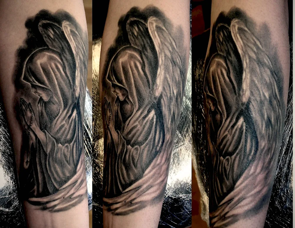 Praying angel tattoo