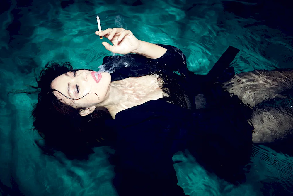 Monica Bellucci in a pool photo shoot.