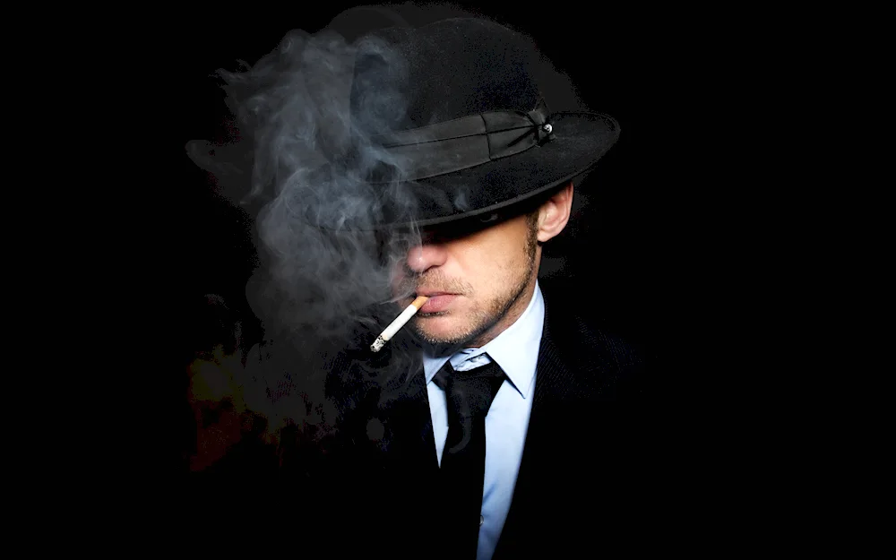 Man in a hat. with a cigar