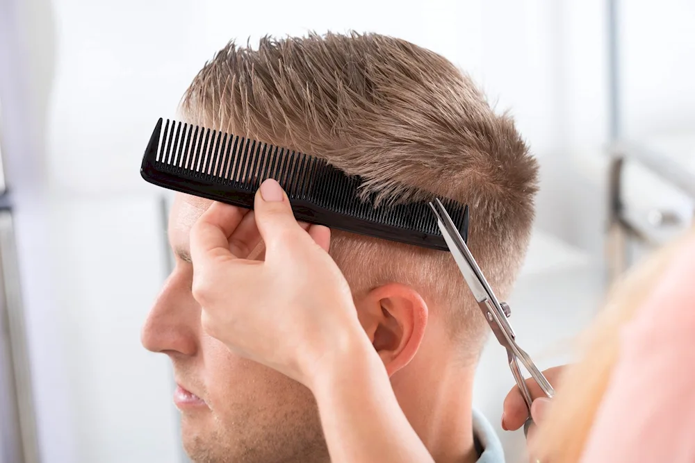 Men's haircut with scissors