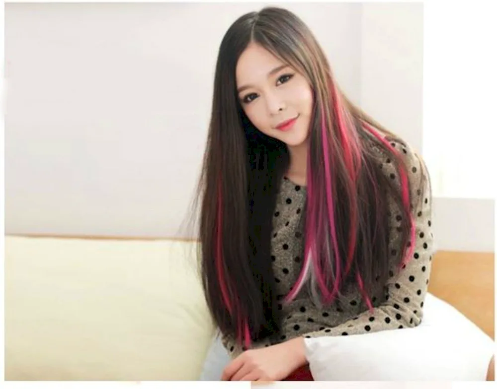 Pink strands on dark hair