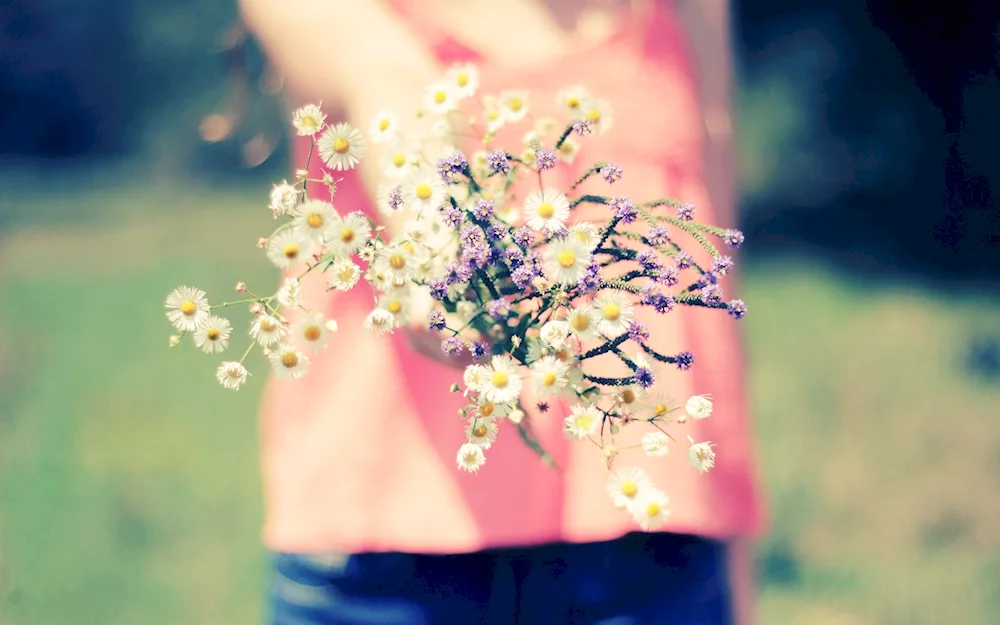 Girl with a bouquet of wildflowers