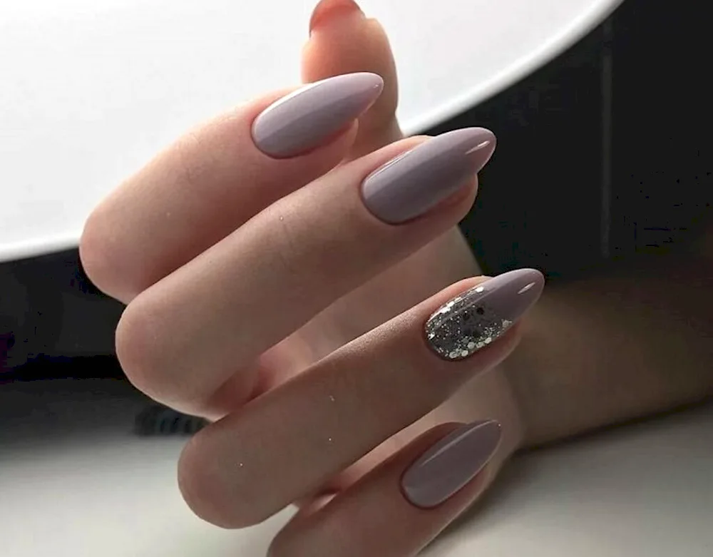 Nude almond manicure