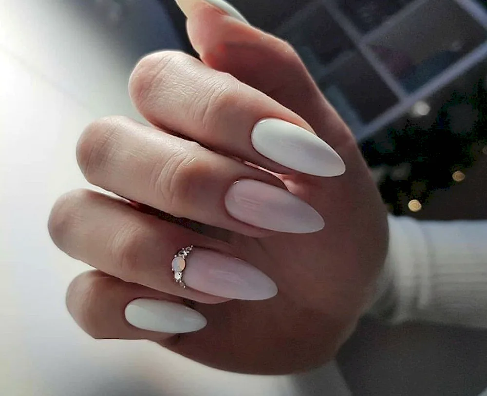 Milk manicure with green leaves