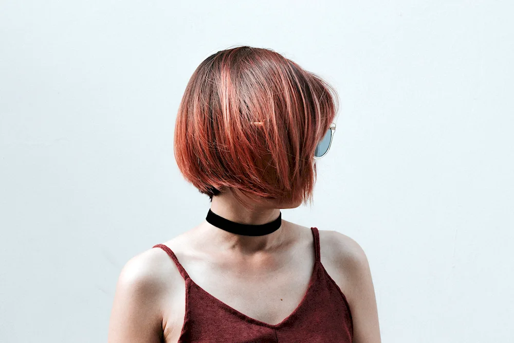 Short haircut with ponytail at the back for women