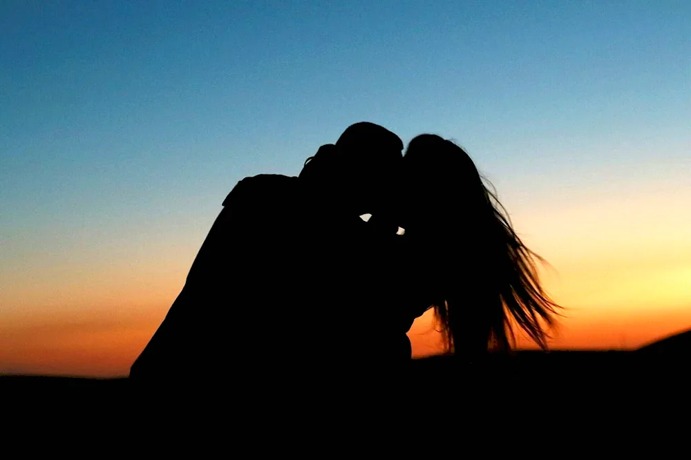 Hugging at sunset