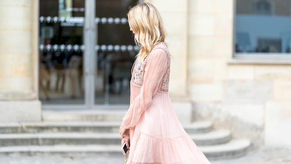 The image with a soft pink dress