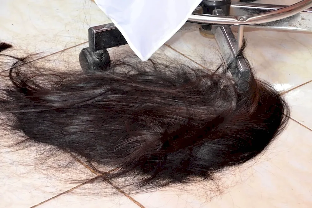 Cut black hair on the floor