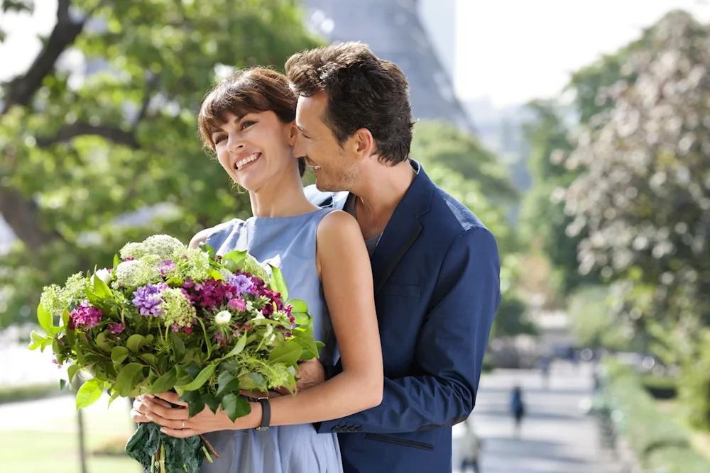 Guy giving flowers to a girl