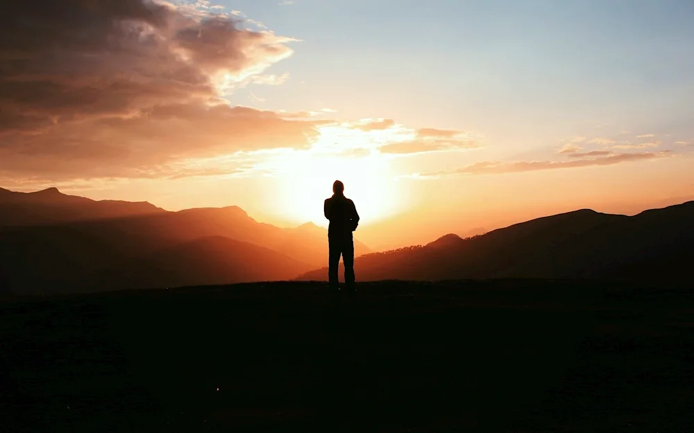 The guy with his back at sunset