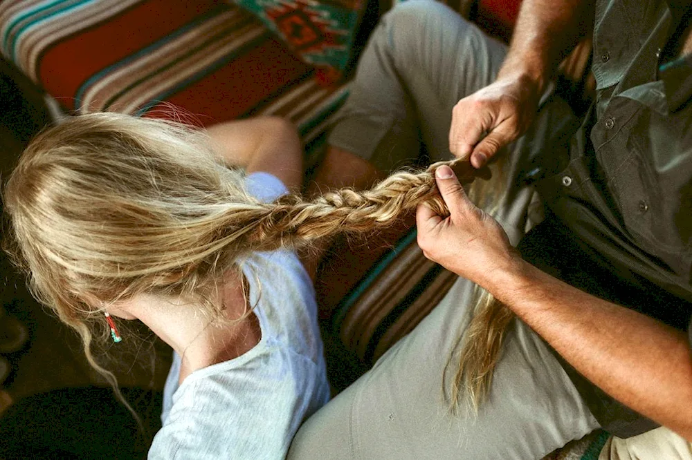 Girl holding a girl's hair