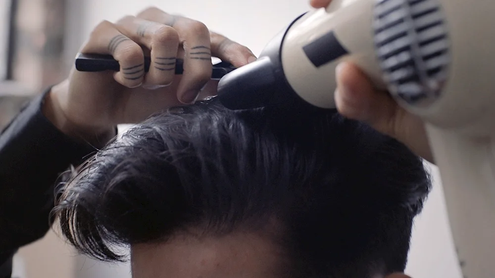 Guy Brushing Hair Styling