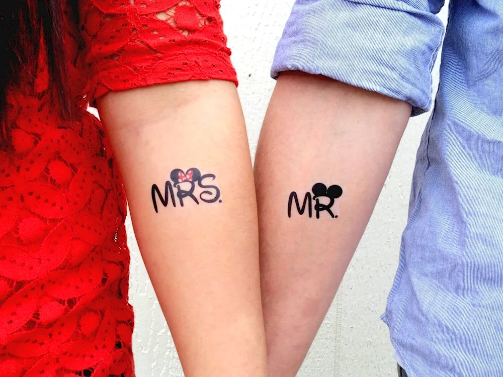 Double tattoos for man and girl