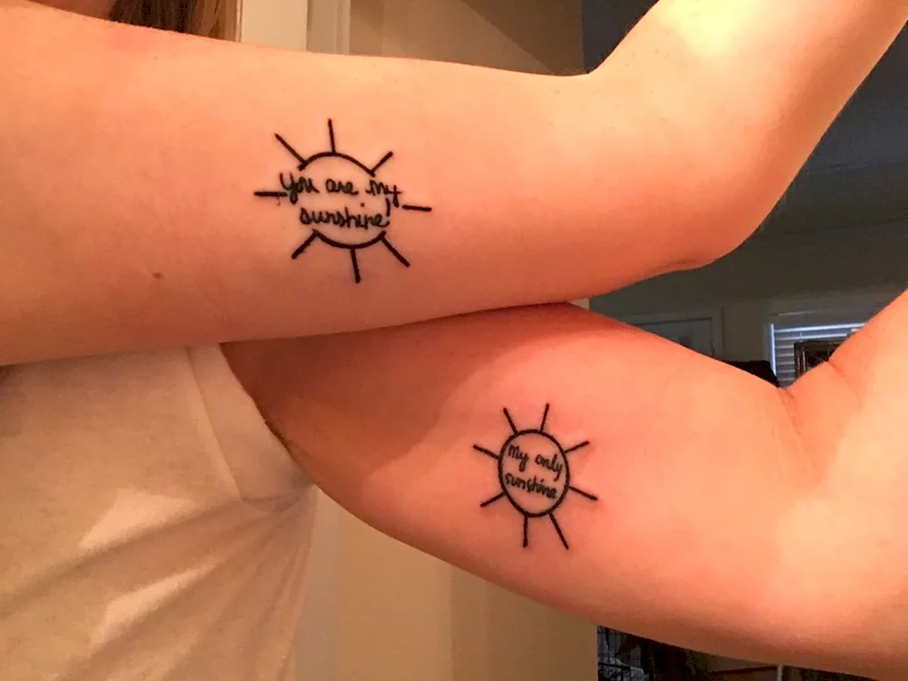 Pair tattoos for mum and daughter