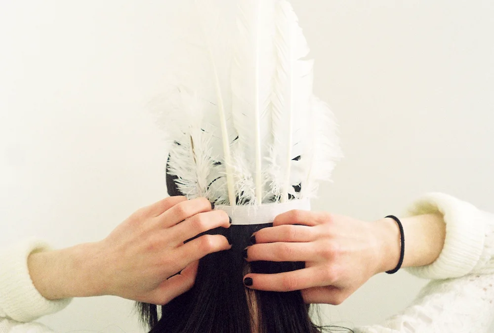 And feathers in her hair