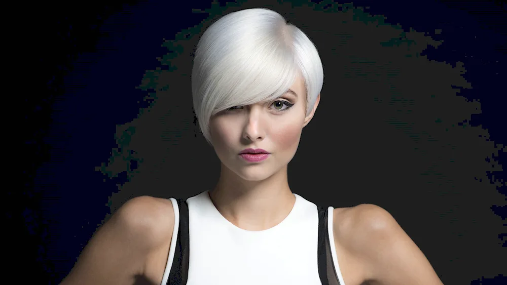 Singer with white hair and short haircut