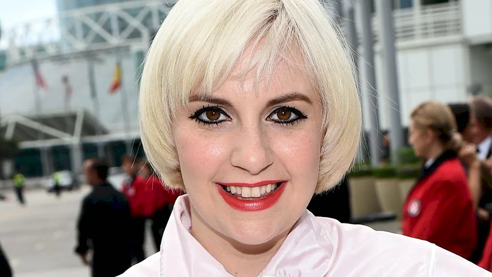 Singer with short white hair