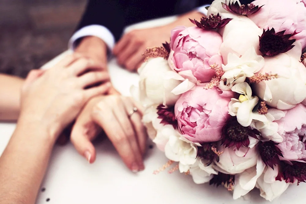 Peonies bouquet in hands