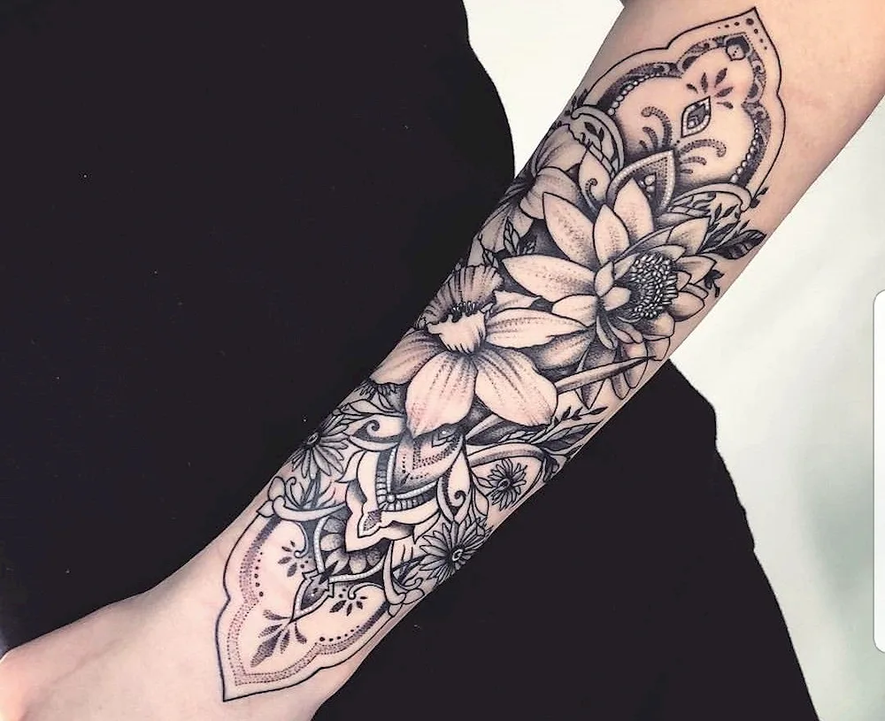 Half sleeve tattoo on forearm