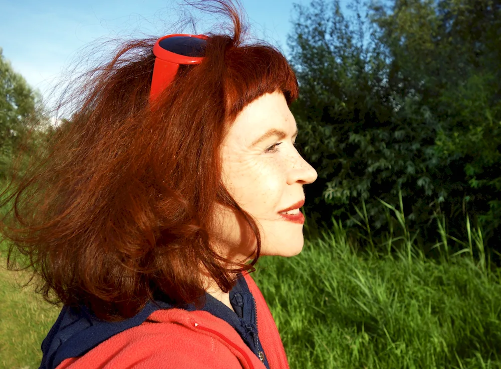 Older woman with red hair