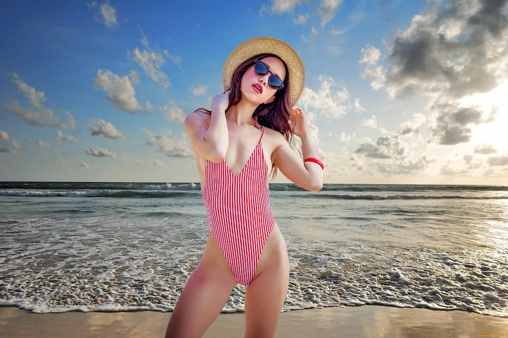 Poses for swimming costume photo at the sea