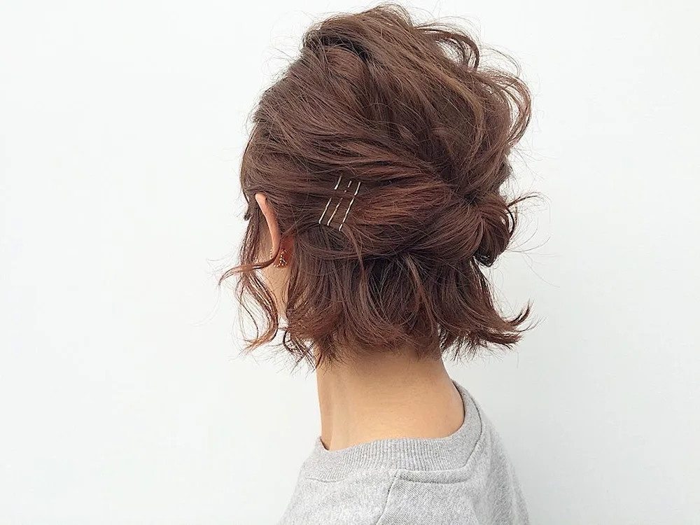 Strict bun hairstyles on medium hair