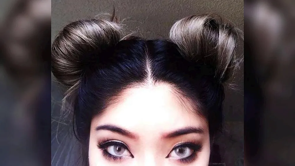 Hairstyle with two buns. Mickey Mouse ears hairstyle