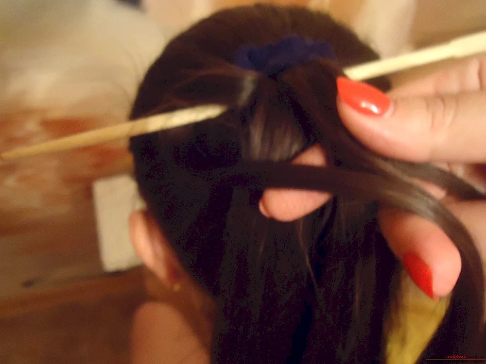 Hairdress with chopsticks hair