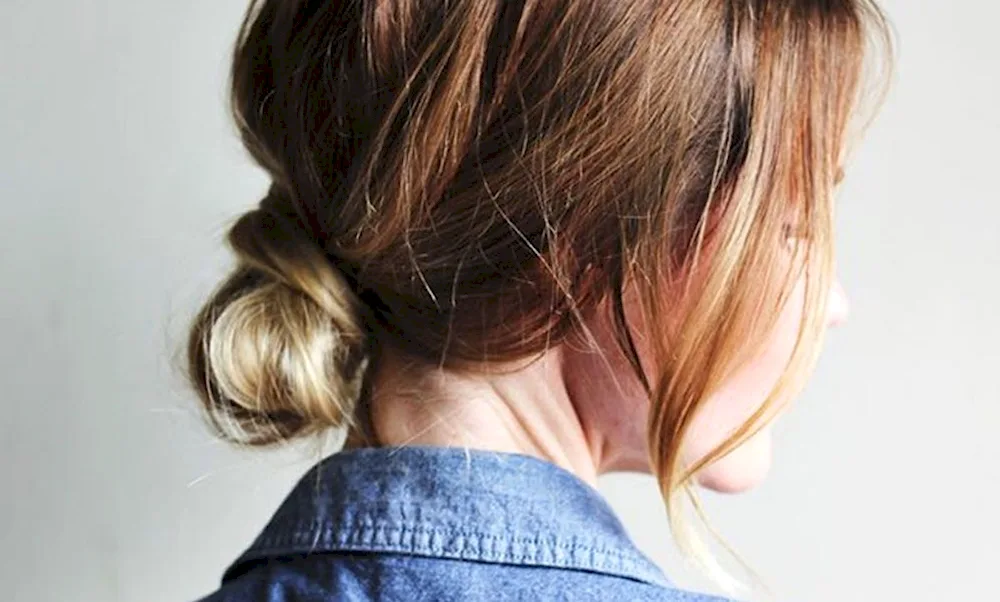 Hair with a bun at the back of her head