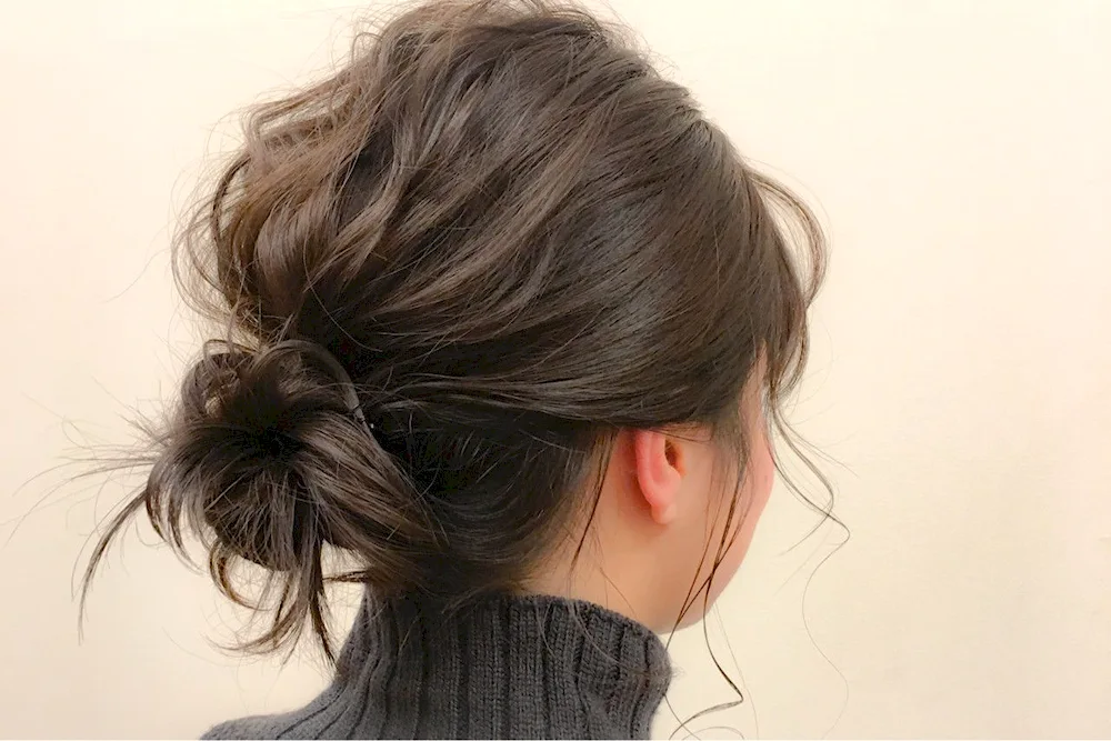 Bun hairstyle on top of the head