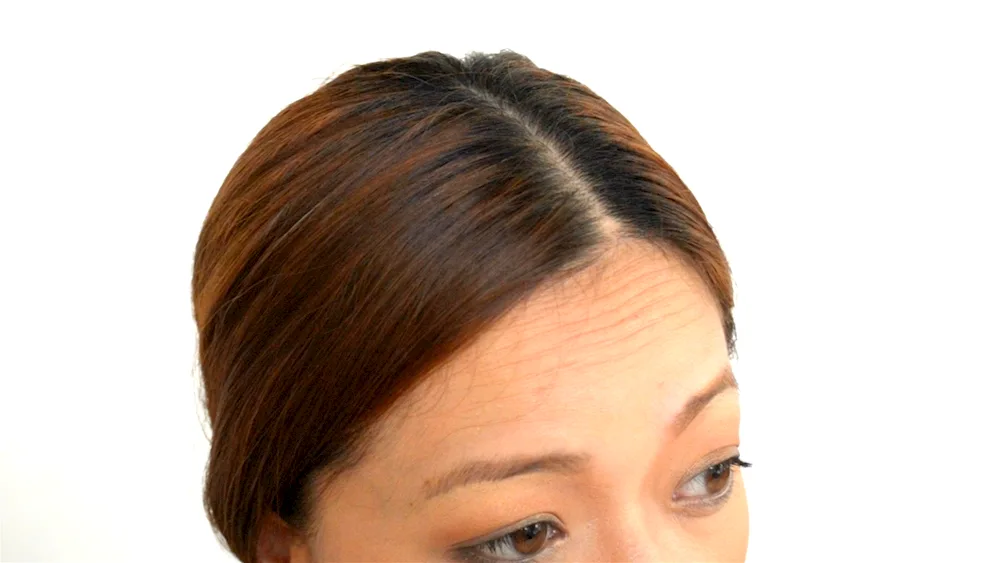 Women's head parting from above