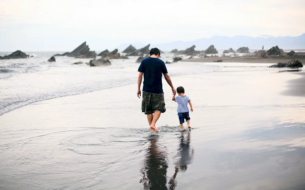 Dad and son at sunset