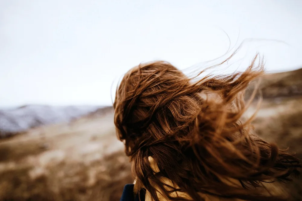 Girl with braids on the neck of the girl behind