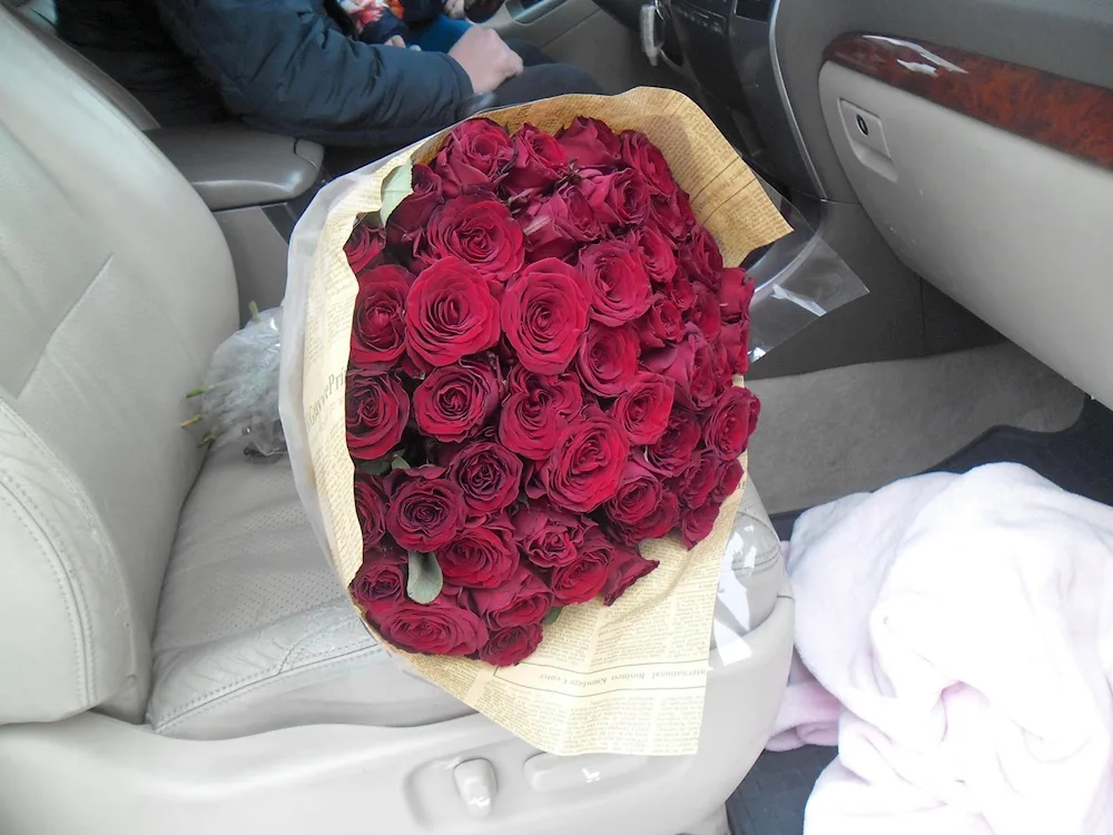 Bouquet of roses in the car