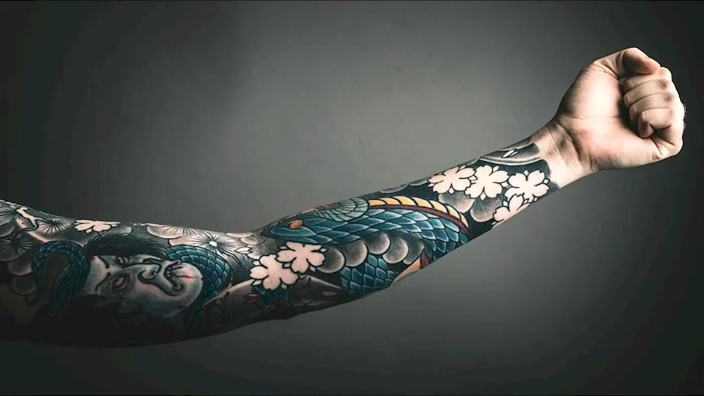 Sleeve tattoos on the bend of the arm for men