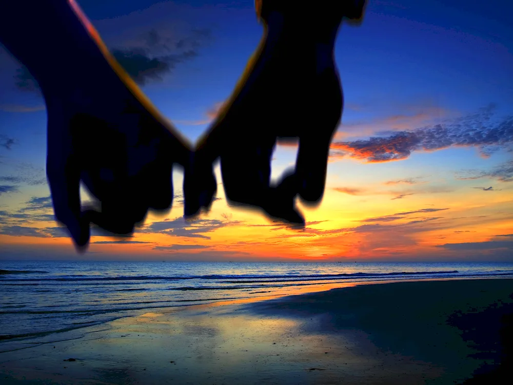 Two people holding hands