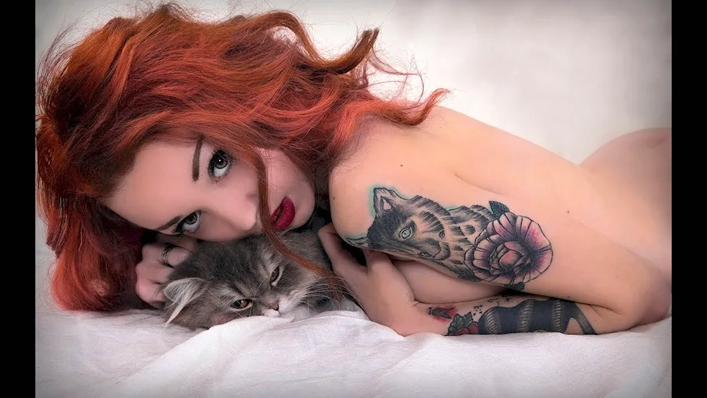 Redhead with tattoos