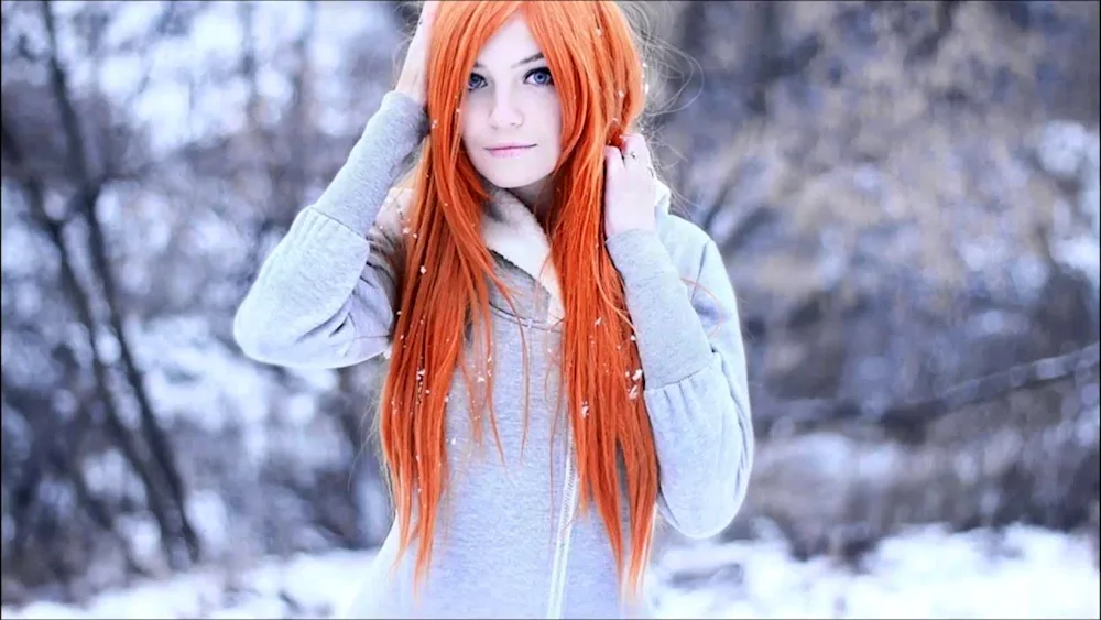 Redheaded girl with bare shoulder