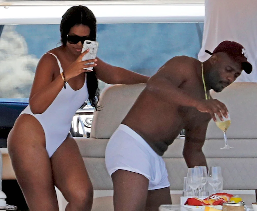 Sabrina Dhowre and Idris Elba on the beach