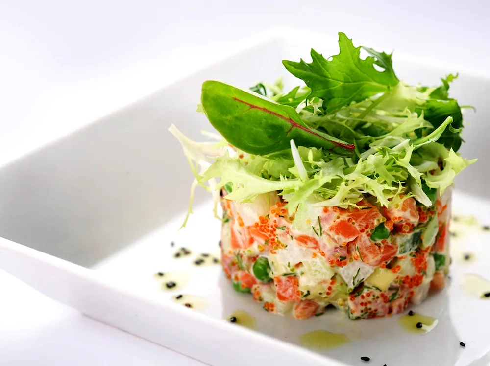 Salads. Olivier with salmon