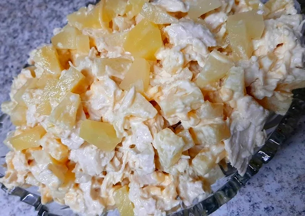 Salad with pineapple and chicken and cheese and walnuts