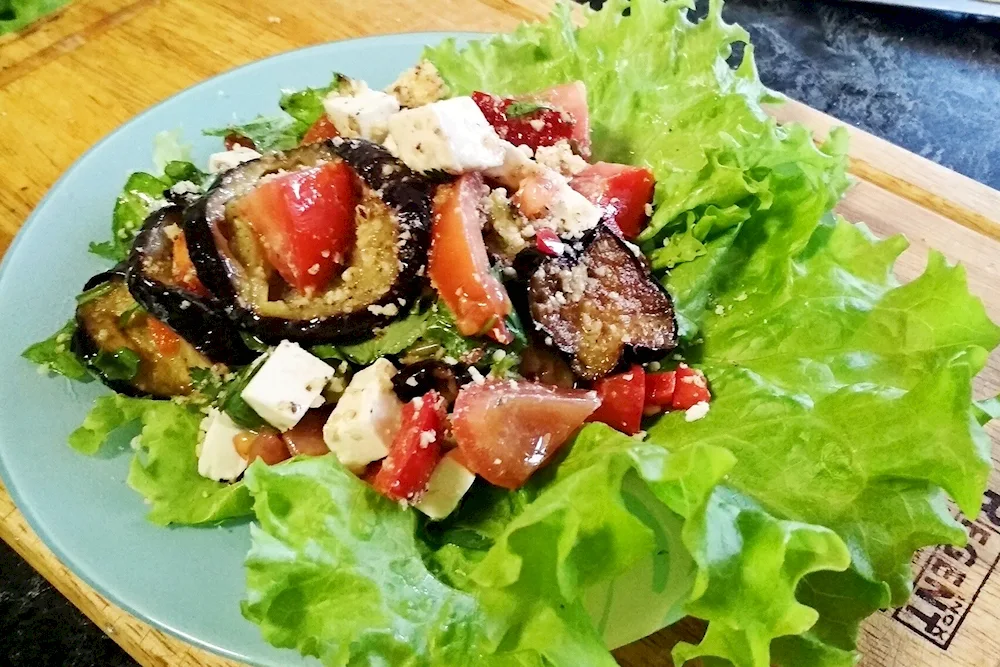 Salad with aubergines and tomatoes and cilantro. tomatoes and coriander