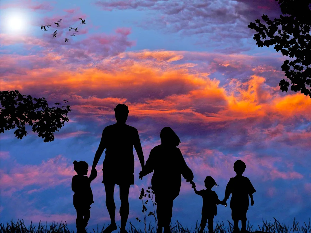 Family with sunset background