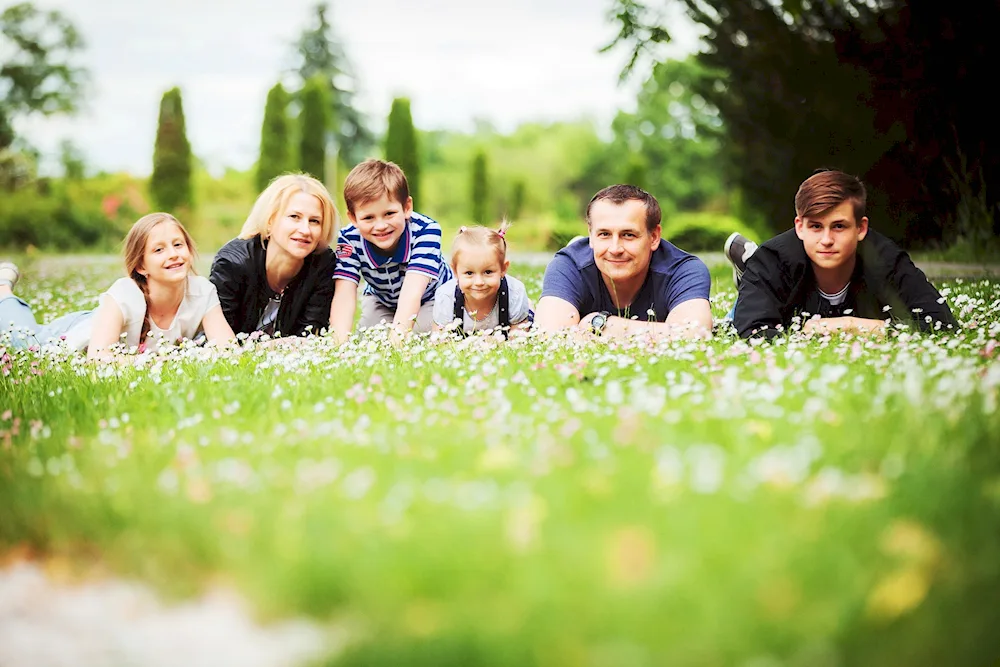 Family photo shoot in blooming garden. nature