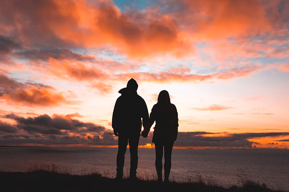 Couple silhouette at sunset