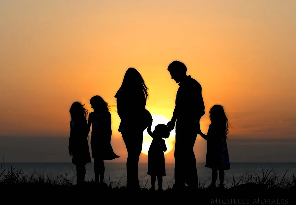 Happy family sunset