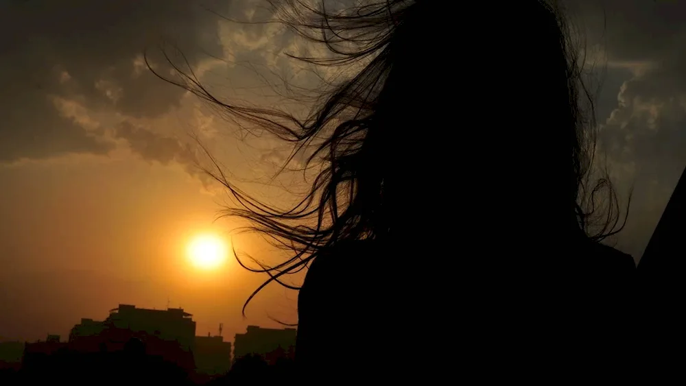 Silhouette of a woman with long hair